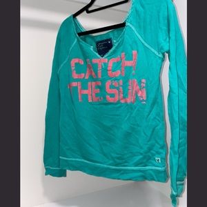 american eagle teal long-sleeve shirt with coral "catch the sun" graphic